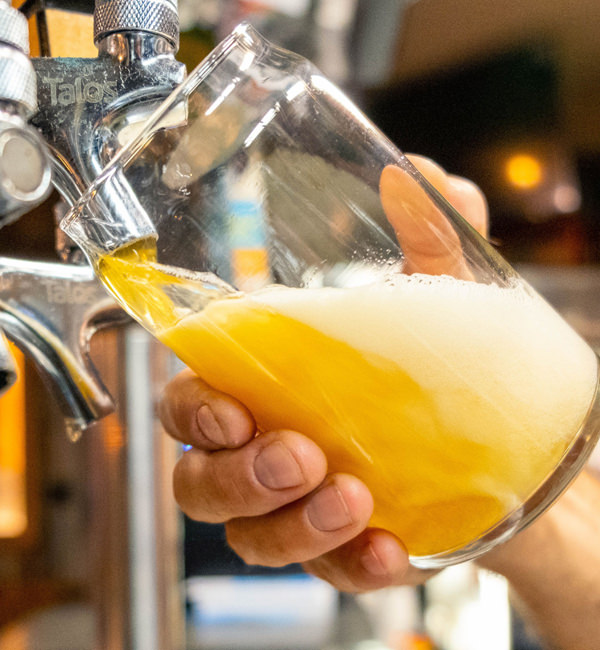 Pouring beer on tap